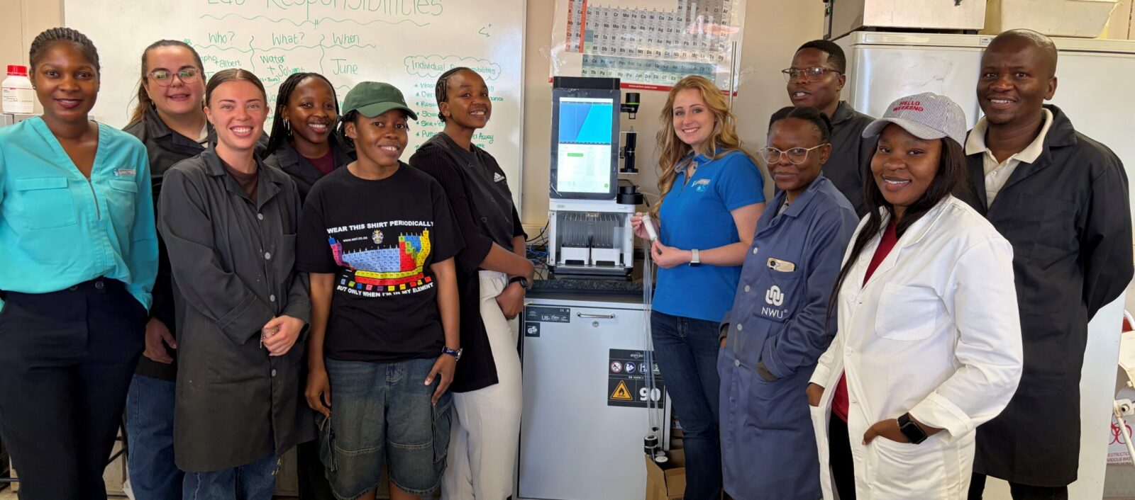 Picture of Labotec staff with the students of Prof. Legoabe and the Buchi C-950 unit in their lab.
